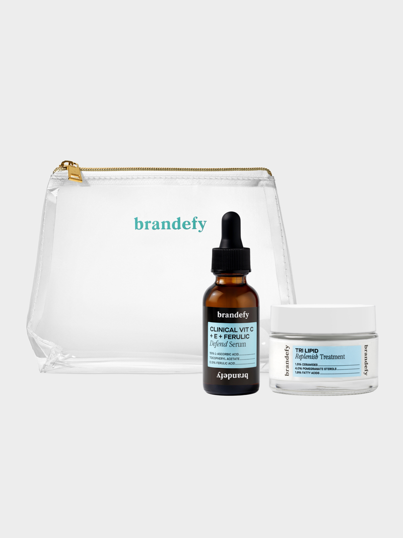 The Defend Derm Duo: an amber dropper bottle of Clinical Vit C + E + Ferulic Defend Serum beside a white jar of Tri Lipid Replenish Treatment.